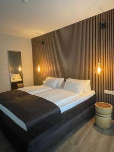 a bedroom with a large bed in a room at Hotel-Restaurant Schraeder in Greven +2 photos