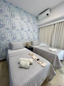 En eller flere senge i et værelse på 305 Flat em Ipanema + 27 billeder