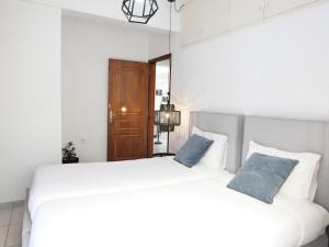 Кровать или кровати в номере Chania Locals Flat