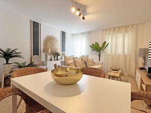 a living room with a table with a bowl on it at APF Beach T2 Cabanas Home by Junto ao Mar in Cabanas de Tavira