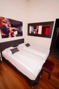 Voodi või voodid majutusasutuse Tralala Hotel Montreux toas