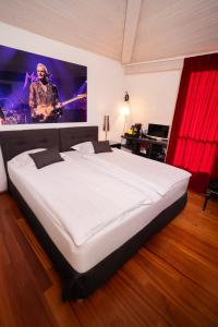 Voodi või voodid majutusasutuse Tralala Hotel Montreux toas