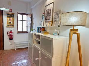 a room with a desk with a lamp in it at Casa Salto Tavira by Junto ao Mar in Tavira