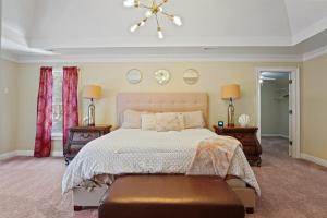 a bedroom with a large bed and two night stands at Great Family Home Near Stone Mountain Pk Sleeps 10 in Conyers