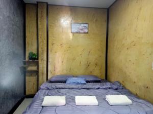 Postel nebo postele na pokoji v ubytování Libong de loft ลิบงเดอลอฟท์