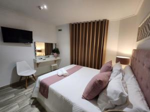 Postel nebo postele na pokoji v ubytování DON LEONE Hotel