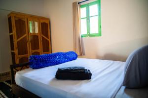 Giường trong phòng chung tại Easy Going Imsouane