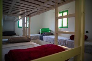 Giường trong phòng chung tại Easy Going Imsouane