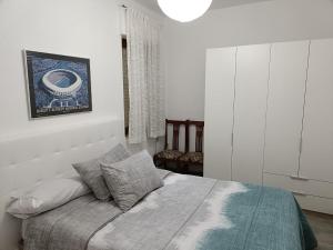 Łóżko lub łóżka w pokoju w obiekcie Apartamento Shenzhen en Astorga Camino de Santiago Cochera bicis