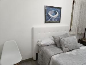 Łóżko lub łóżka w pokoju w obiekcie Apartamento Shenzhen en Astorga Camino de Santiago Cochera bicis