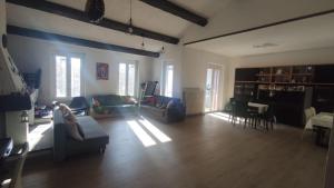 a living room with a couch and chairs and a table at Villa Marilu in Trezzano sul Naviglio