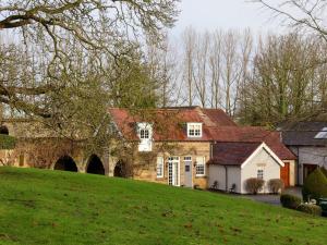 a house on a hill with a green field at The Bothy in Knaresborough