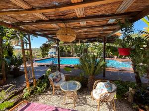 a patio with chairs and a swimming pool at Hotel Altea Paradise 1917 - Adults Only in Altea