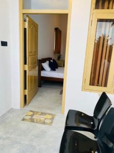 Postel nebo postele na pokoji v ubytování Mahesh Homestay