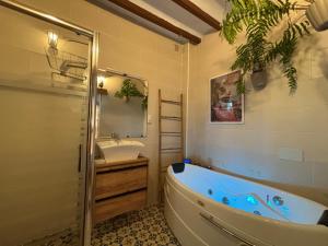 a bathroom with a tub and a sink at Hotel Altea Paradise 1917 - Adults Only in Altea