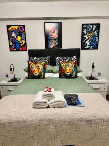a bedroom with a bed with towels on it at LoughView BED & BREAKFAST in Belfast