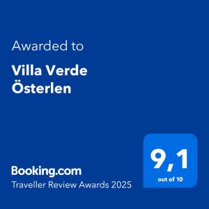 a blue text box with the words awarded to villa yvette osterler at Villa Verde Österlen in Glemminge