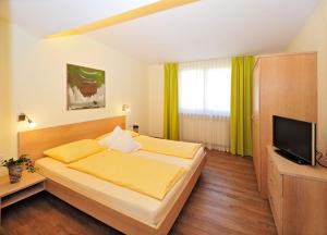 Postel nebo postele na pokoji v ubytování Residence Mignon + 37 fotografií