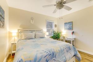 a bedroom with a bed and a ceiling fan at 1 Mi to Stone Mountain Park Outdoor Haven! in Stone Mountain