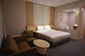 Postel nebo postele na pokoji v ubytování GTV Hotel + 37 fotografií
