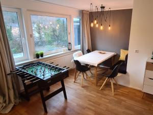 a room with a table and chairs and a window at 1Step2AllCities House&Garden in Wuppertal +93 photos