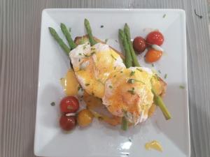 a plate of food with chicken and vegetables on a table at No 12 B&B in Dungarvan