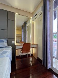 Postel nebo postele na pokoji v ubytování Casa Rosa Suítes 5 min de caminhada da PRAIA DA PONTA NGRA