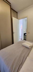 a bedroom with a large bed with a sliding glass door at Condominium SPAZIO BLU in Sao Jose do Rio Preto +38 photos