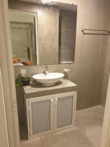 a bathroom with a white sink and a mirror at Lanka villa mirissa private villa 6bedrooms in Mirissa