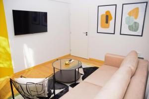 a living room with a couch and a table at Christians Haus in Târgu-Mureş