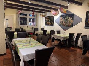 a dining room with tables and chairs at Hotel am Schloss in Frankfurt/Main