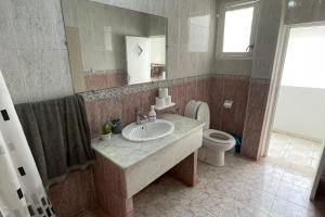 a bathroom with a sink and a toilet at Dar Al Hajja Fatima in Rabat