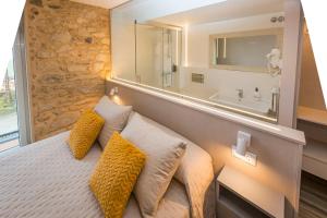 Posteľ alebo postele v izbe v ubytovaní Apartamentos Currás en Touriñán