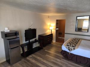 Postel nebo postele na pokoji v ubytování Sage Motel + 37 fotografií