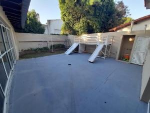 a patio with two white stairs on the side of a building at Casa en Miramar Alquiler temporario in Miramar