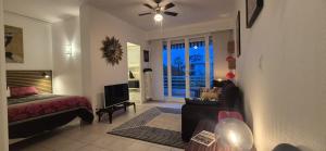a bedroom with a bed and a television in a room at Cannes Studio near Croisette Plage in Cannes