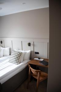 Ένα ή περισσότερα κρεβάτια σε δωμάτιο στο Hotell Esplanad