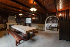 a large room with a table and a bench at GuestReady - Rustic Oasis in Vila Nova de Cerveira in Vila Nova de Cerveira