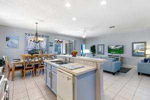 a kitchen and living room with a dining room at Gorgeous Davenport 5 Bed Villa with Pool Hot Tub in Davenport