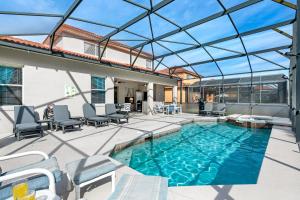 a swimming pool with a glass roof on a patio at Gorgeous Davenport 5 Bed Villa with Pool Hot Tub in Davenport