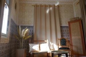 A bed or beds in a room at chez Aissam