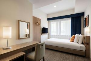Voodi või voodid majutusasutuse Four Points Flex by Sheraton Shin Osaka toas
