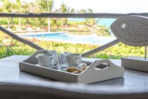 Příslušenství pro přípravu čaje a kávy v ubytování Zawadi Hotel, Zanzibar