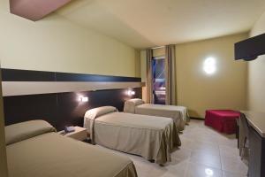 Posteľ alebo postele v izbe v ubytovaní Melqart Hotel
