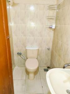 a small bathroom with a toilet and a sink at Sunset Mirage in Luxor +30 photos