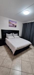 Ένα ή περισσότερα κρεβάτια σε δωμάτιο στο Your Home Away from Home