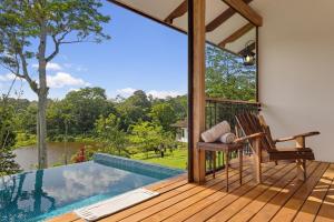 a view from the deck of a villa with a plunge pool at El Lugar in Tigre