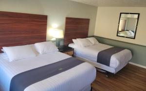 Ένα ή περισσότερα κρεβάτια σε δωμάτιο στο Sage Motel