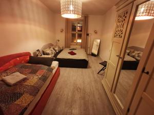 a small room with two beds and a couch at Forsthaus Nicolai in Pretzsch +72 photos