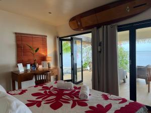 Voodi või voodid majutusasutuse Ocean Breeze Bungalow toas